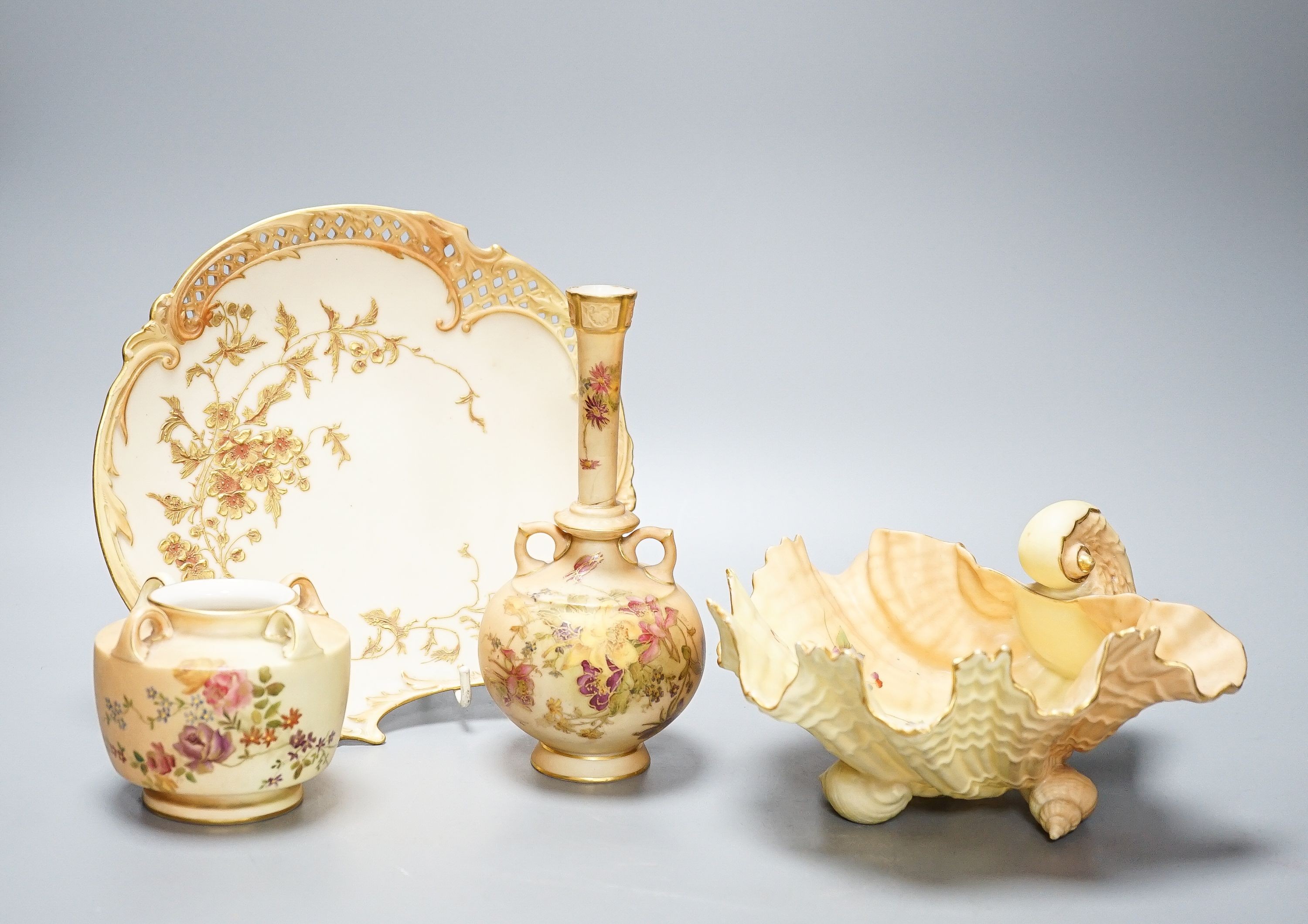 A group of ornamental Royal Worcester blush ivory ground items, including a shell dish, 18cm wide, two vases, a dish etc.
